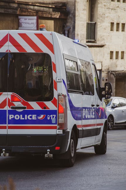 A police van on a street in Marseille, capturing urban life and law enforcement presence.